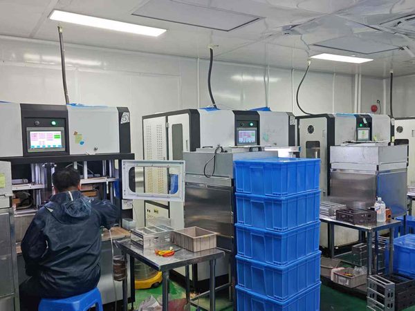 Worker at a laminating machine